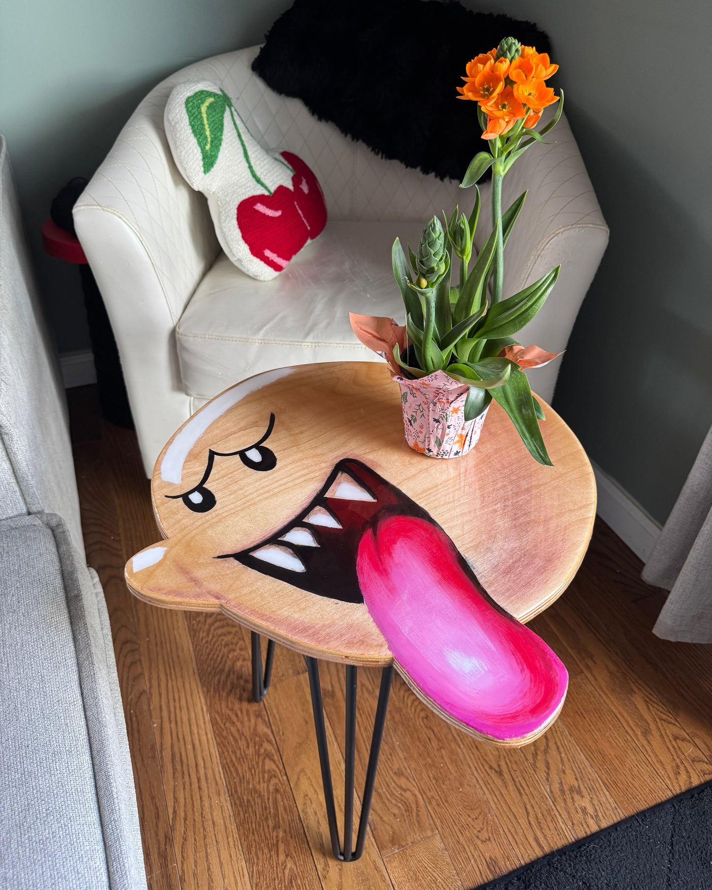Decorative table with Boo from Super Mario on a wooden floor